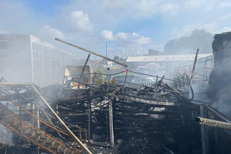 More than 80 firefighters were deployed to tackle a ferocious garage fire, which spread to nearby vehicles and buildings. Smoke could be seen filling the sky.