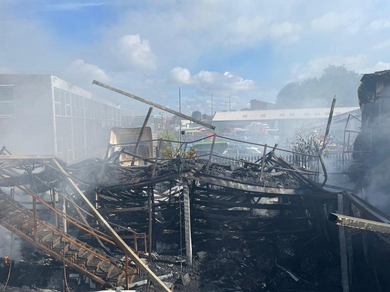 More than 80 firefighters were deployed to tackle a ferocious garage fire, which spread to nearby vehicles and buildings. Smoke could be seen filling the sky.