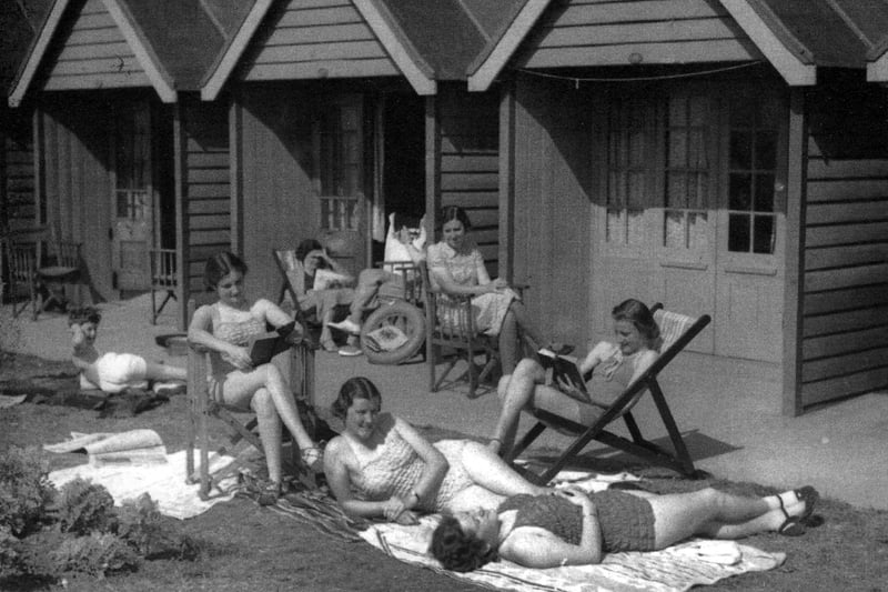 Families enjoying the beach huts between South Parade Pier and Eastney in 1938.