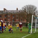 Dale Holmes (centre, going down on one knee) heads one of his four goals against AFC Netley. Picture: Andy Nunn