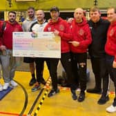 Pictured are the Paulsgrove and Ted Baker AFC coiaching team with a cheque for money raised for Friends Fighting Cancer.
