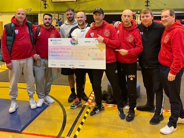 Pictured are the Paulsgrove and Ted Baker AFC coiaching team with a cheque for money raised for Friends Fighting Cancer.