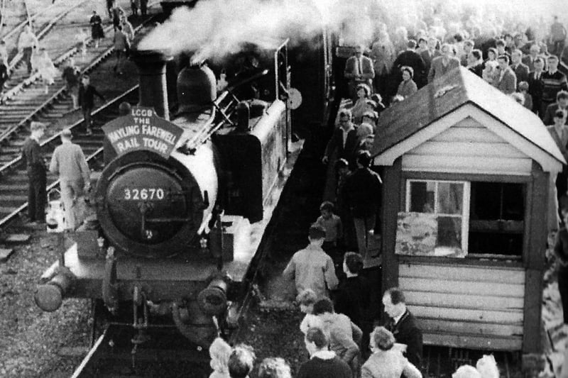 The Hayling Billy, the last one to run. On  November 3, 1963 the last and final train ran to and from Hayling Island. Passengers surround the locomotive.