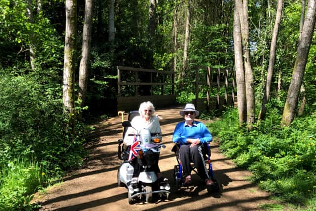 John and Betty Grey out on their mobility scooters during lockdown. Pictures: Contributed.