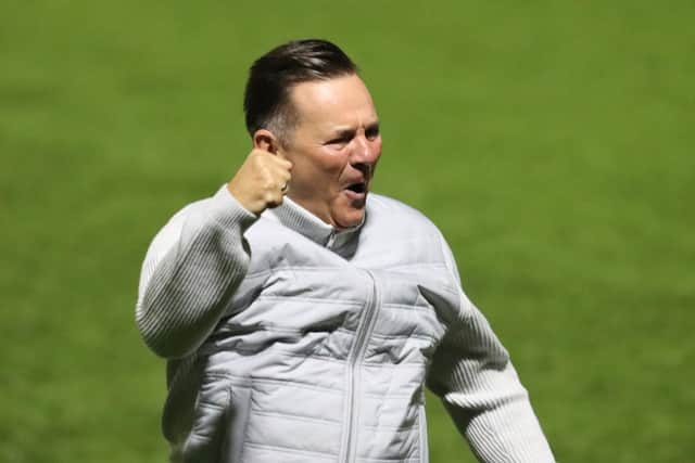 Hawks manager Paul Doswell celebrates his side's late, late leveller. Picture by Dave Haines