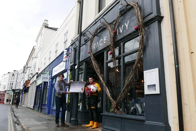 Thomas du Plessis, owner of Grace and Ivy in Marmion Road, Southsea, with Josh Owen from the RNLI.