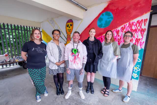 Charla Grant, founder of The Grateful Arts Club, Alex Ruddock, project collaborator, artist Mister Samo, The Harbour School assistant head Helen Sanger, Molly Penney from the engagement office at the city council, and Harbour School teacher Danny Harmer near the mural. Picture: Habibur Rahman