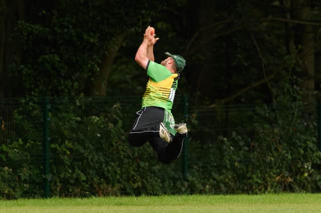 Sarisbury Athletic skipper Josh Hill saves a boundary by deflecting the ball back over the ropes during his side's SPL T20 Plate loss to Portsmouth & Southsea. Picture: Keith Woodland