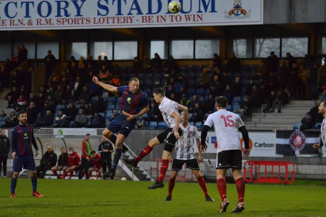 US Portsmouth striker Andrew Todd wins this header during the FA Vase win against Millbrook. Pic: Daniel Haswell.