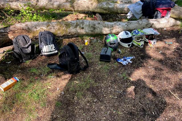 Caption: Police have threatened to destroy all these items abandoned by a large group of motorcyclists who fled after being caught breaking lockdown laws to have a picnic in woodland at Dunsbury Hill. Photo: Havant police