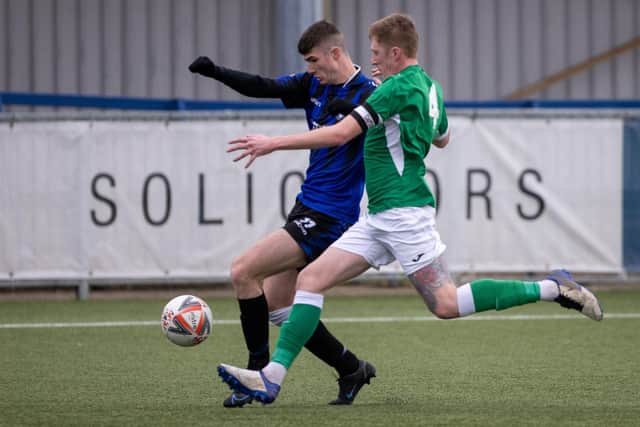 Clanfield's Dan Penfold (left) about to be challenged by Moneyfields skipper Liam Kyle. Picture by Alex Shute