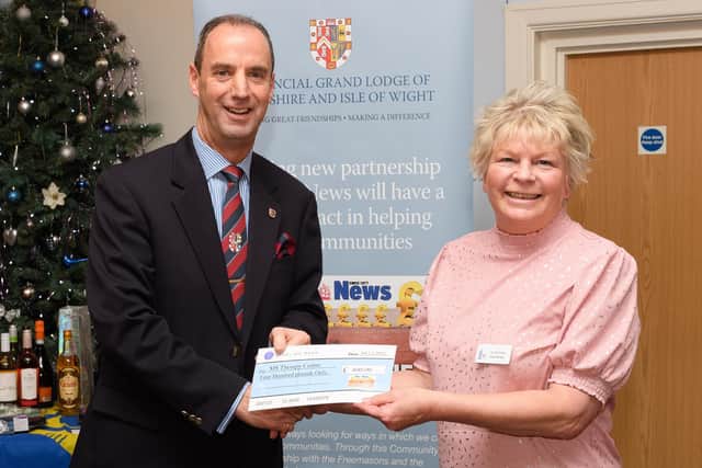 Pictured is: John Whitaker, Head of the Hampshire & IoW Freemasons presents a cheque to the MS Therapy Centre and Jo Jennings, the centre manager.
Picture: Keith Woodland (041221-38)