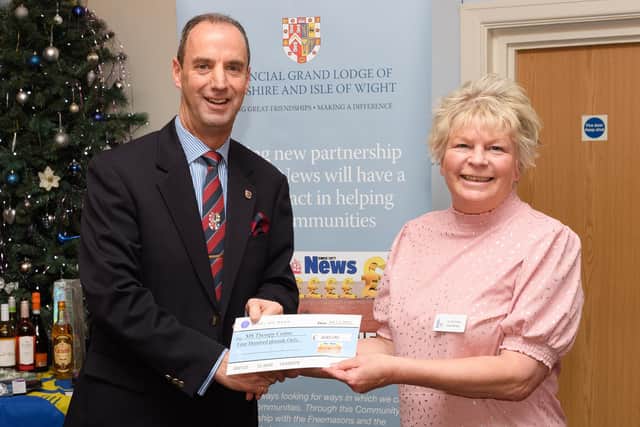 Pictured is: John Whitaker, Head of the Hampshire & IoW Freemasons presents a cheque to the MS Therapy Centre and Jo Jennings, the centre manager.

Picture: Keith Woodland (041221-38)