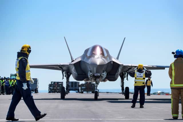 Pictured here is one of  four operational F-35B Lightning Jets landing on HMS Queen Elizabeth for the first carrier sea training. Photo: Royal Navy