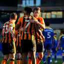 WIMBLEDON, ENGLAND - FEBRUARY 27: Mallik Wilks of Hull City celebrates with Callum Elder after scoring their team's third goal from the penalty spot during the Sky Bet League One match between AFC Wimbledon and Hull City at Plough Lane on February 27, 2021 in Wimbledon, England. Sporting stadiums around the UK remain under strict restrictions due to the Coronavirus Pandemic as Government social distancing laws prohibit fans inside venues resulting in games being played behind closed doors. (Photo by Alex Davidson/Getty Images)