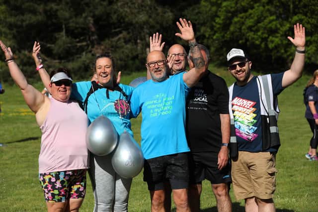 Wendy Duff, second from left (with balloons), pictured with friends and family, completed her 100th parkrun on her 50th birthday at Portsmouth Lakeside on Saturday Picture: Sam Stephenson.