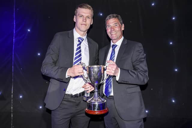 Sean Raggett is given one of a host of fan-group awards at Pompey's end-of-season dinner.