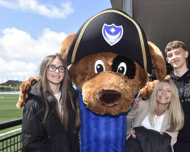 A charity football match between Pompey Charity Squad v FC Global Kickers took place on bank holiday Monday, May 27, 2024, at the John Jenkins Stadium in Portsmouth, with profits going to Pompey in the Community and Global Family.

Pictured is: (l-r) Evie Harding (13), Gemma Harding and Archie Harding (16) with Nelson from Portsmouth.

Picture: Sarah Standing (270524-3124)