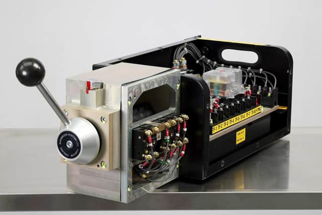 ON TRACK: Barnbrook System’s brake controller with cover open to show interior of system