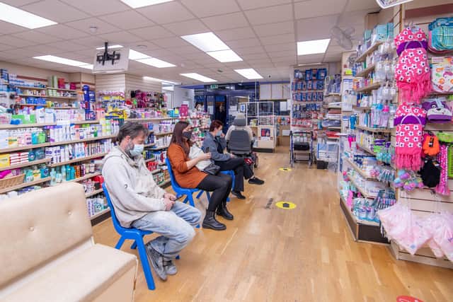 People waiting inside Goldchem Pharmacy for their booster jab. Picture: Habibur Rahman