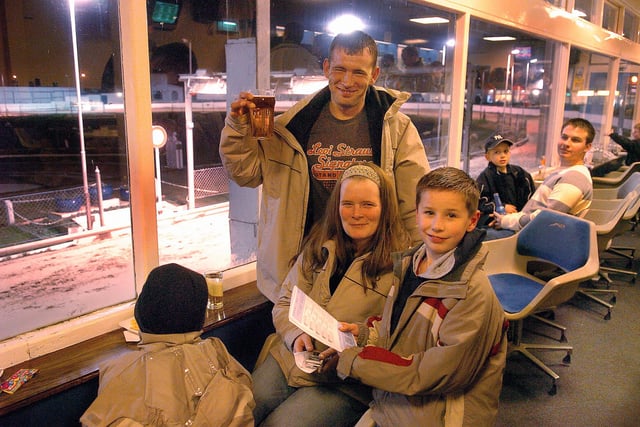 Night out at the dogs for Gary Nash (31) and his wife Sara Nash (33) from Waterlooville, with their sons Callum (eight) and  Jack (nine) (who is not seen facially in picture at left). 2006. Picture: Mike Scaddan. 060583-0266