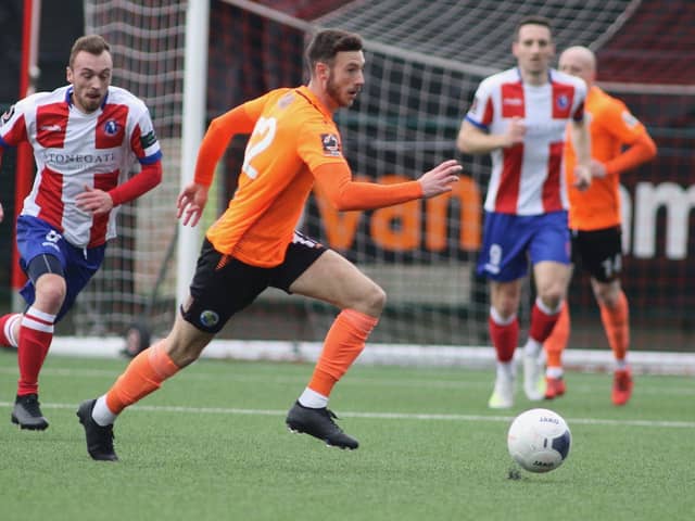 Hawks in action at Dorking in their last game of the NL South season on March 14. Now both clubs are united in condemning the National League's decision to scrap play-offs and not promote Hawks as the second-placed team. Photo By Kieron Louloudis