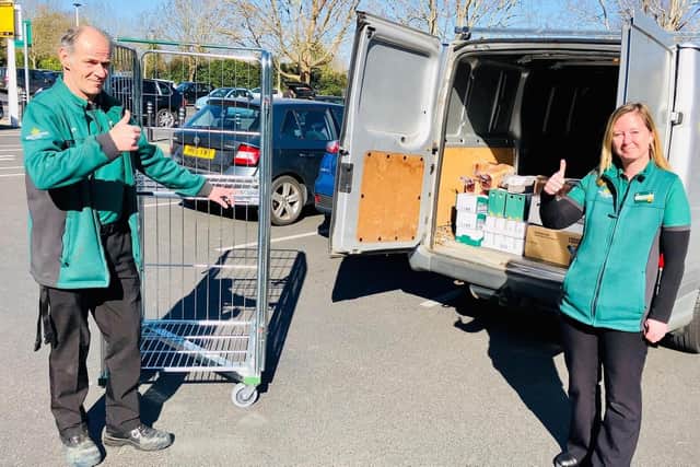 Paul Blythe from Morrisons Gosport with Charlotte Tillett, the store’s head of food bank operations, loading up the Gosport Borough FC kit van, re-purposed now to support those in need in the town. Picture by Keith Slater