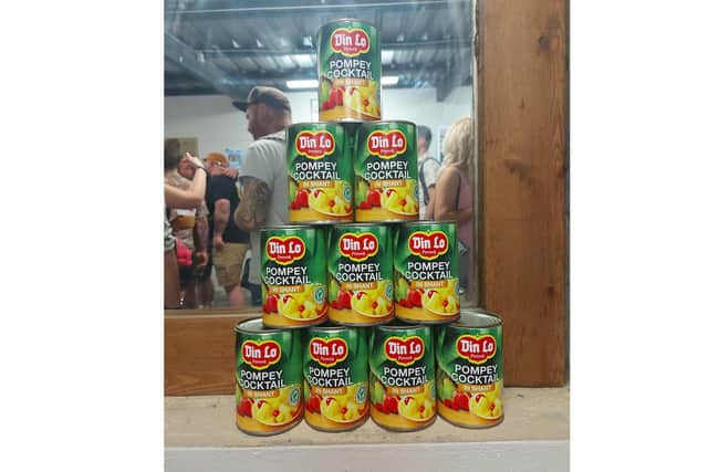 Tins of Pompey Banana Club's Dinlo-brand Pompey Cocktail at Mash-Up in The Warehouse on Marmion Road, Southsea, July 29, 2022
