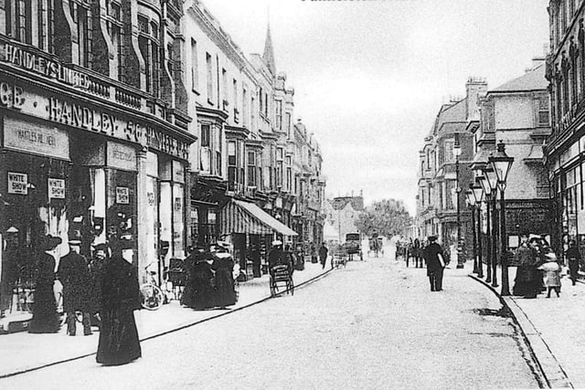 Palmerston Road. Most of what you see in this photo was swept away during World War Two, but in the top left hand corner can be seen the steeple of St Jude's Church in Kent Road. This is a view from Osbourne Road, looking north up Palmerston Road, Southsea with Handley's store to the left of the photograph.