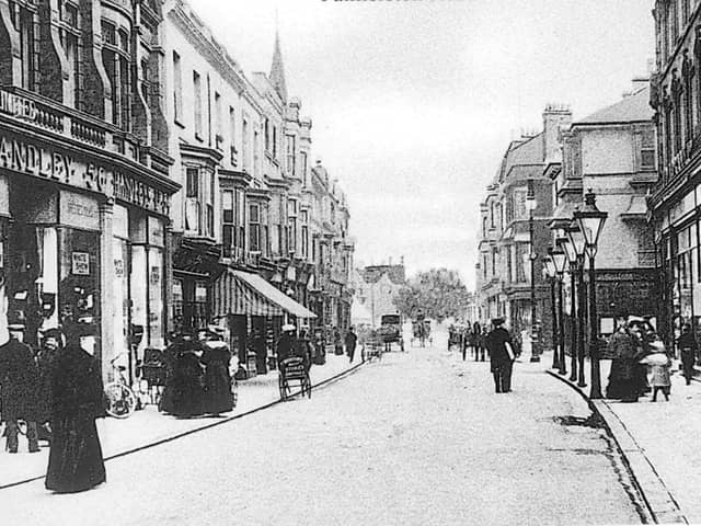 Palmerston Road. Most of what you see in this photo was swept away during World War Two, but in the top left hand corner can be seen the steeple of St Jude's Church in Kent Road. This is a view from Osbourne Road, looking north up Palmerston Road, Southsea with Handley's store to the left of the photograph.