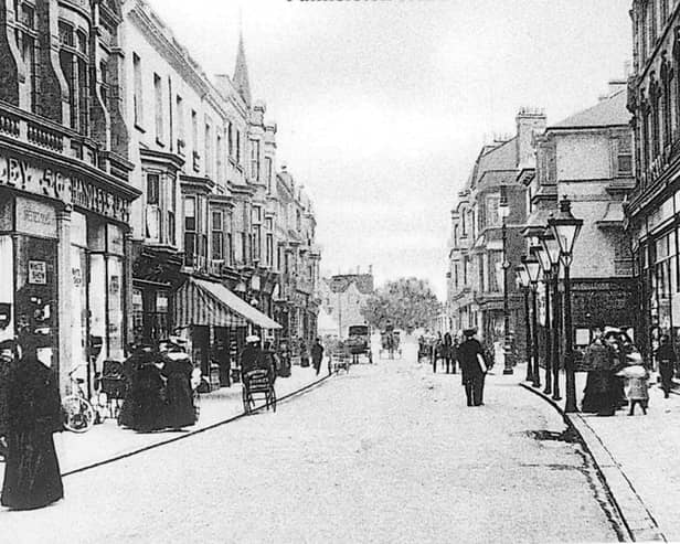 Palmerston Road. Most of what you see in this photo was swept away during World War Two, but in the top left hand corner can be seen the steeple of St Jude's Church in Kent Road. This is a view from Osbourne Road, looking north up Palmerston Road, Southsea with Handley's store to the left of the photograph.