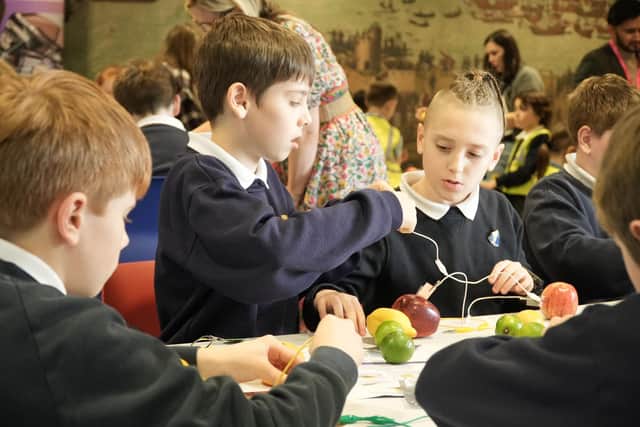 Portsmouth school children engaged in Limelight experiment at the Mary Rose Museum