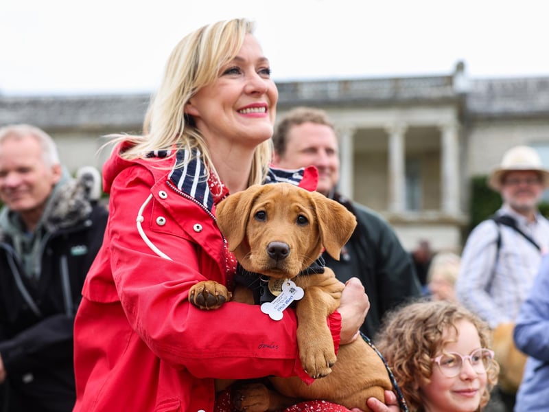 A view of the Labrador Parade at Goodwoof 2024, a dog event held at Goodwood Estate in Chichester. PA Photo. This year's event features a Labrador Parade, led by The Duke of Richmond, in celebration of the breed. Elsewhere at the event, visitors can try forest bathing, truffle hunting, watch top canine athletes in competition, enjoy wellness workshops and listen to talks from behavioural and veterinary experts. Picture credit should read: Matt Alexander/PA Media