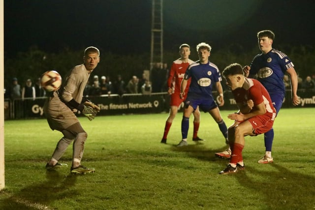 Zack Willett heads Horndean's stoppage time winner against Portland. Picture by Martin Denyer