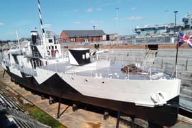 The Monitor HMS M33 in dry dock in Portmouth Naval Base. Note the dazzle camouflage along her side. Picture: Bob Hind.