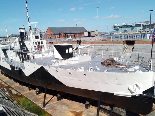 The Monitor HMS M33 in dry dock in Portmouth Naval Base. Note the dazzle camouflage along her side. Picture: Bob Hind.