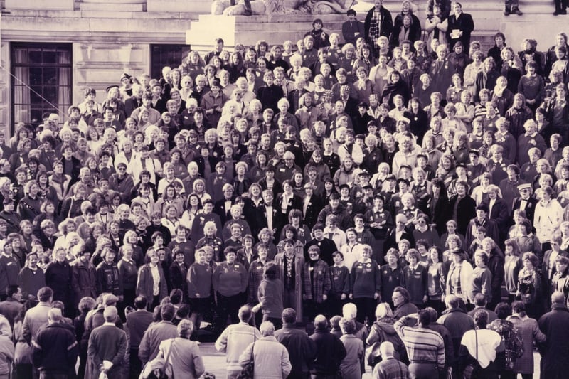 Singers on the steps of Portsmouth Guildhall for the mass sing-in at the close of the Ladies Association of Barbershop Singers convention in November 1993. The News PP5503