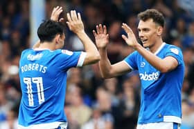 Kal Naismith, right, celebrates with Gary Roberts. Picture: Joe Pepler