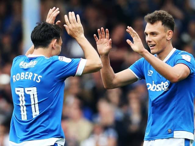 Kal Naismith, right, celebrates with Gary Roberts. Picture: Joe Pepler
