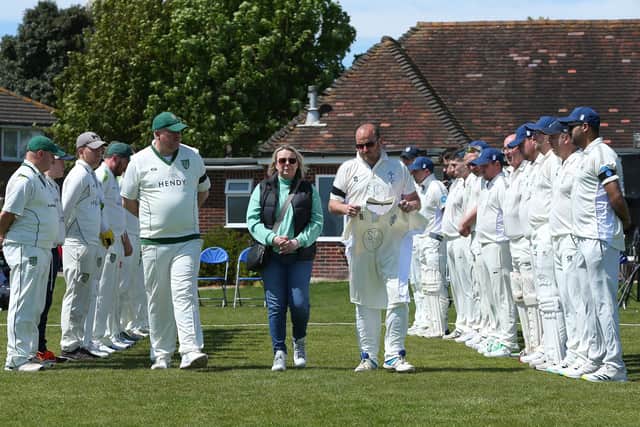 Grant Bauchop's partner, Sophie Naessens, and captains Steve Osgood, left, and John Creamer walk through a Guard of Honour holding his shirt. Picture: Chris  Moorhouse
