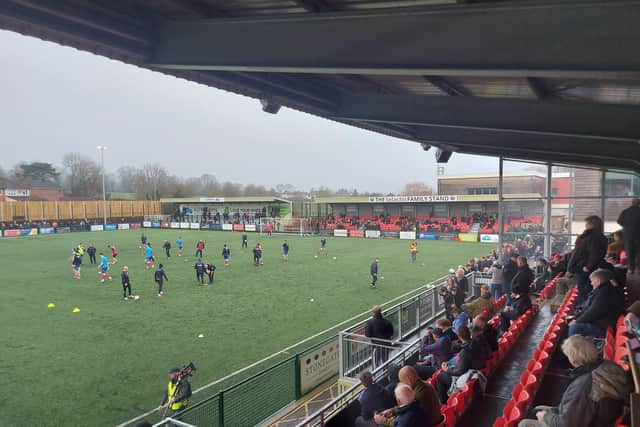 A covered terrace and a covered stand behind one of the goals at Dorking's Meadowbank Stadium. Picture: Simon Carter