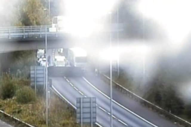 Overturned vehicle on M3 southbound link with M27 on opposite side of carriageway to vehicle transporter fire this morning. Pic Highways England