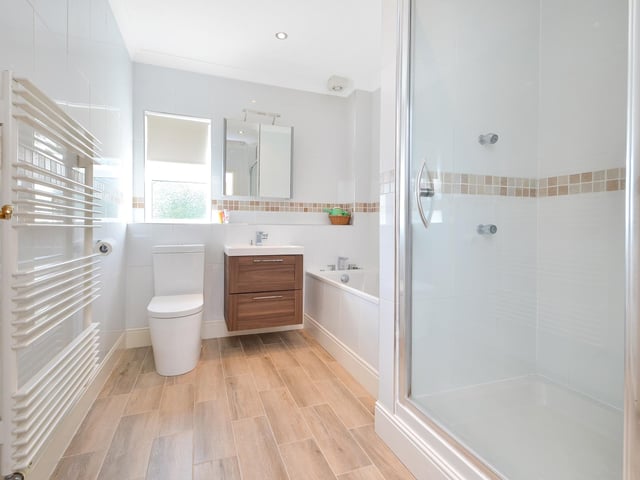 This four bedroom detached family home is on the market at a guide price of £950,000. It is listed by Fine and Country.