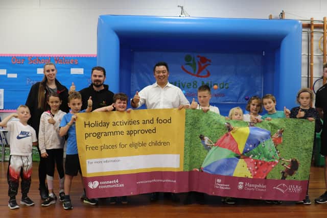 Havant MP Alan Mak with children and staff at a HAF holiday club in Emsworth