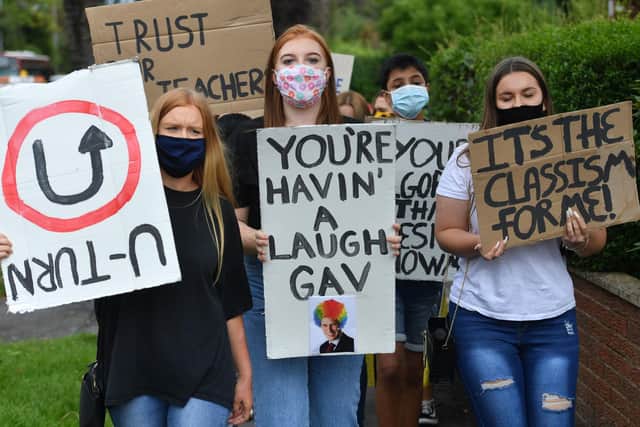 Students from Codsall Community High School march to the constituency office of their local MP Gavin Williamson, who is also the Education Secretary, as a protest over the continuing issues of last week's A level results which saw some candidates receive lower-than-expected grades after their exams were cancelled as a result of coronavirus. Picture: Jacob King/PA Wire
