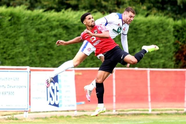 Harvey Bradbury (white) in action at Fareham prior to his dismissal. Picture by Tom Phillips