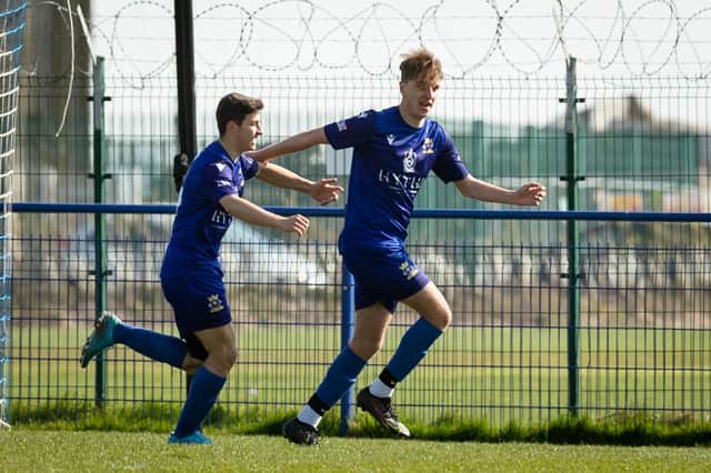 Ryan Harfield celebrates his early goal for Baffins against Horndean.
Picture: Keith Woodland