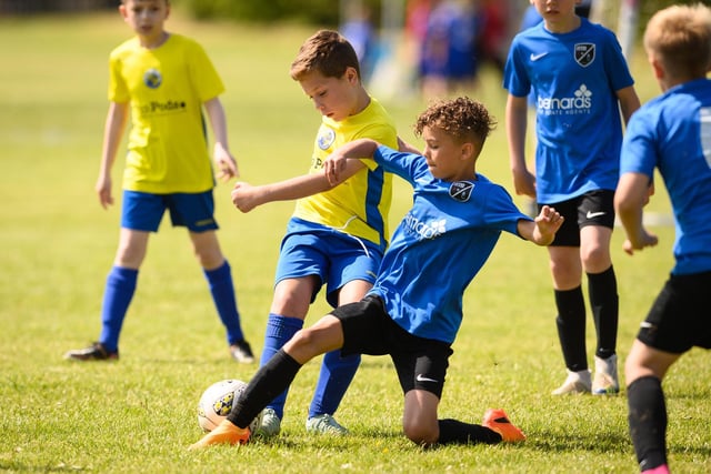 Action from the Clanfield youth football tournament at Horndean Technology College. Picture: Keith Woodland (270521-289)