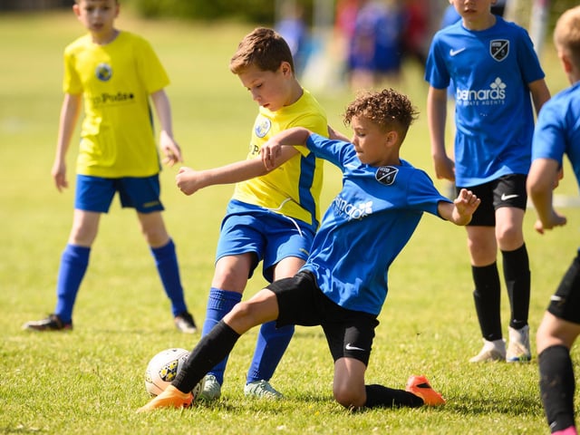 Action from the Clanfield youth football tournament at Horndean Technology College. Picture: Keith Woodland (270521-289)