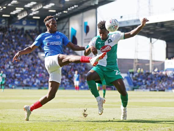 Jamal Lowe battles with Plymouth's Ashley Smith-Brown during a Fratton Park clash in September 2018. Picture: Joe Pepler/Digital South